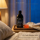 Rituel du soir avec TotalRestore Magnésium 12,5 ml sur table de chevet pour favoriser le sommeil